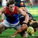 Demons charge to the top after nailing the ‘Adelaide double’; Strife for Pickett over high hit